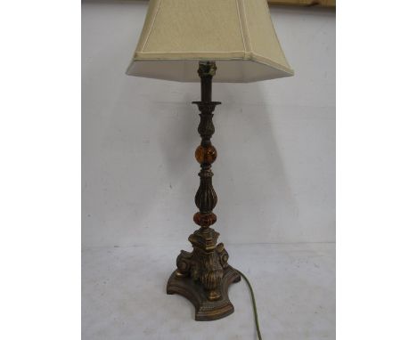 An ornate brass and amber coloured glass lamp&nbsp;