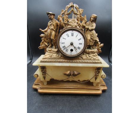 A French Ormolu mantle clock 34cmH with key no glass on clock face 