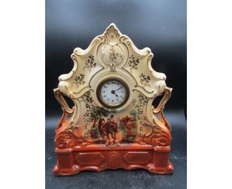 A Staffordshire flat back ceramic clock 33cmH
