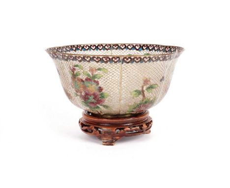 A late 19th century Chinese 'Plique a jour' bowl, decorated with panels of growing flowers on a scale ground, ruyi head borde