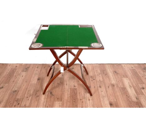An early 20th Century mahogany folding campaign games/card table, in the manner of J. C. Vickery (London), 76 x 110cms high.