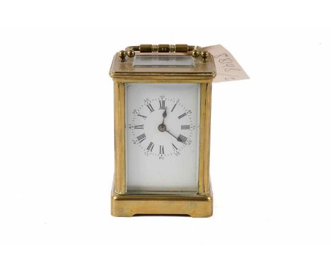 A late 19th Century French carriage clock with enamelled Roman dial, platform lever escapement.