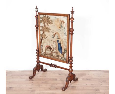 A decorative Victorian carved walnut firescreen, the embroidered panel depicting an angel and a man, (possibly Moses), 77 x 1
