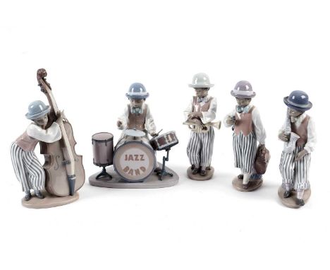 A Lladro decorative ceramic jazz band, comprising: a double bass player, a trumpet player, a clarinet player, a saxophonist, 