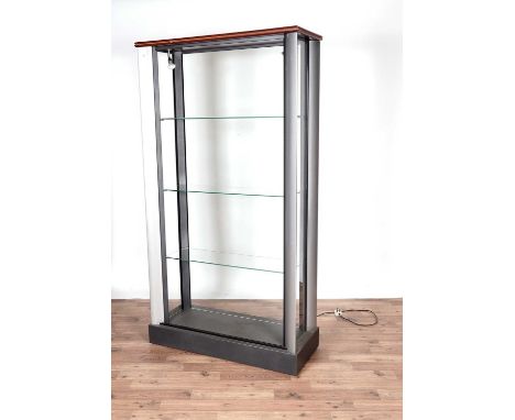 A modern shop display cabinet with grey painted metal frame, glazed doors and panels to the sides and the back, 100 x 40 x 19