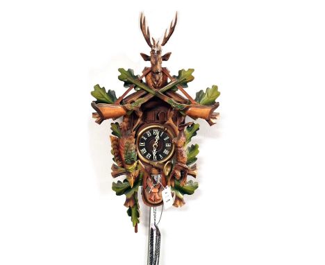 Bachmaier and Klemmer: a modern German cuckoo clock, with pendulum and weights.