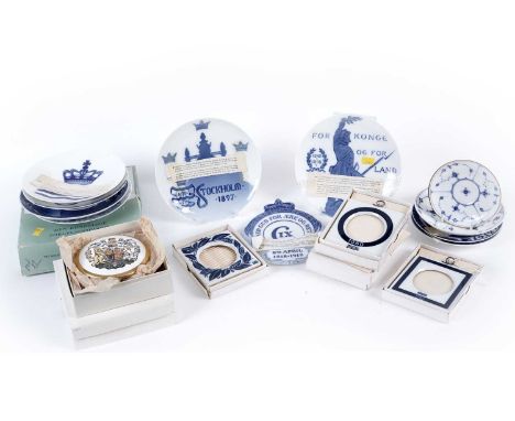 A collection of Royal Copenhagen and other decorative ceramic plates and wall plaques, some boxed; together with a Coalport Q