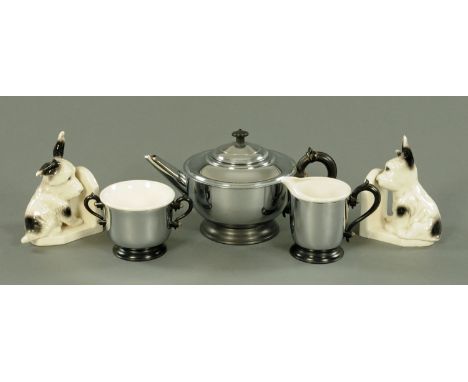 An Art Deco ceramic and chrome Patent tea service, and a pair of Ware puppy bookends.