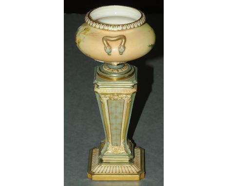 A Royal Worcester vase, in the form of an urn on stand, registered number 301166, puce mark to base, height 21 cm. CONDITION 