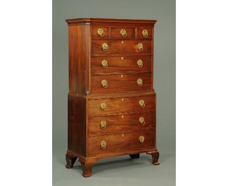 A George III mahogany chest on chest, the top half with canted angles and all raised on bracket feet.  Width 108 cm.
