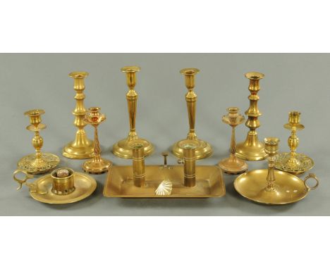 Four pairs of brass candlesticks, twin chamber stick and two further chambersticks.  Tallest 22.5 cm.  CONDITION REPORT: One 