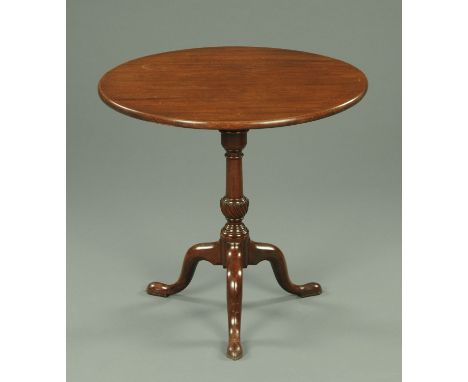 A George III mahogany tripod table, with well figured top with moulded edge and snap action above a turned and twist reeded c