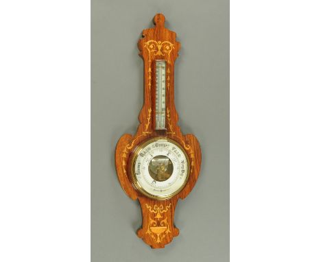 An Edwardian inlaid rosewood Art Nouveau aneroid barometer, height 86 cm.