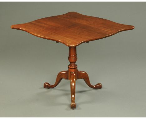 A Georgian walnut tripod table, with shaped top, turned column and three downswept legs terminating in pad feet.   CONDITION 