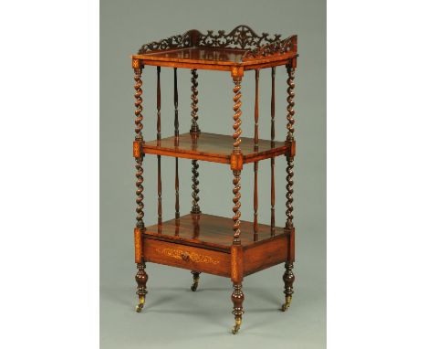 A Victorian rosewood whatnot stand, with fretwork gallery, twist turned supports, frieze drawer and raised on turned legs wit