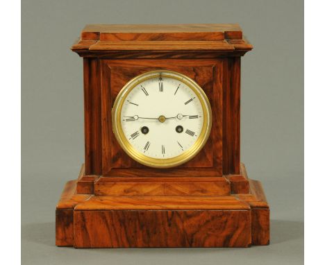 A Victorian walnut cased mantle clock, with two-train striking movement.  Height 26 cm, width 26 cm. 