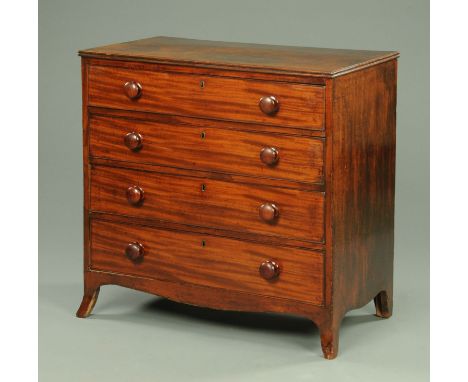A Georgian mahogany chest of drawers, with four long graduated drawers with wooden knob handles and raised on splayed bracket