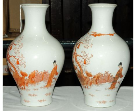 A pair of Chinese hand painted vases, 20th century, depicting three scholars seated at a table beneath a tree decked with lan