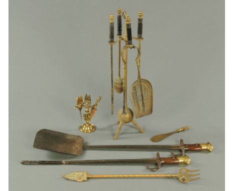 A fire shovel and poker, formed from a 19th century French bayonet, further fire tools, toasting fork, shoehorn, bottle opene
