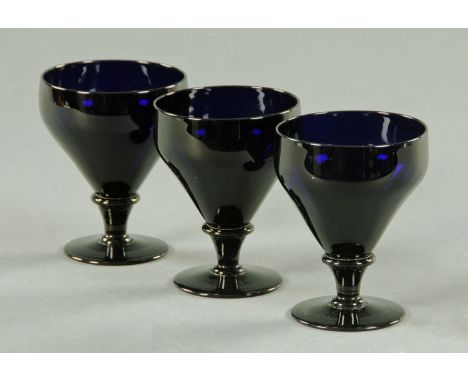 Three Bristol blue glass rummers, 19th century, having a funnel shaped bowl with single knop and short stem. CONDITION REPORT