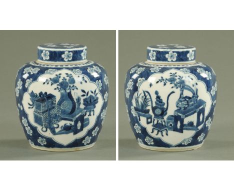 A Chinese blue and white ginger jar and cover, mid 19th century with shaped preserves of precious objects against a blossomin