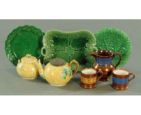 A Victorian Majolica teapot and matching sucrier, each with ivy leaf decoration against a basket moulded ground, 3 Emporium M