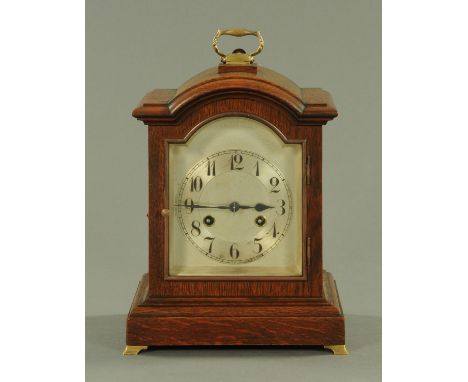 A Junghans oak cased bracket clock, circa 1910, the eight day movement chiming on a single gong with brass carrying handle an