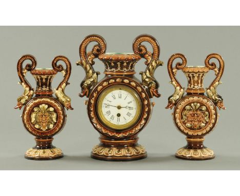A Continental Majolica clock garniture, the clock with single-train movement.  Clock height 34 cm.