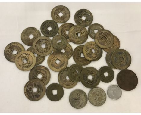  A small collection of Chinese coins, to include Kwang-Tung Province 20 cent silver coins.  