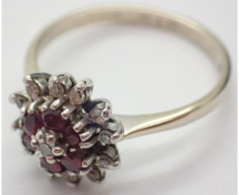 Diamond and ruby flower head ring size P A/F CONDITION REPORT: One small diamond missing. 