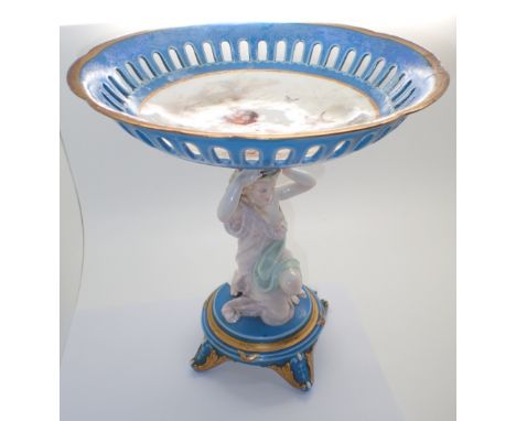 Large continental ceramic porcelain tazza supported by figurine A/F H: 28 cm  CONDITION REPORT: There is poor restoration to 