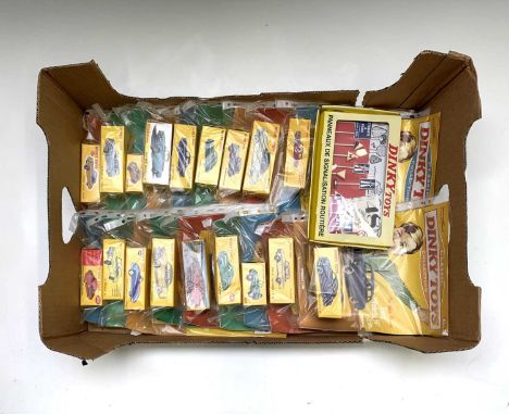 Atlas Edition Dinky Toys - A box containing 18 different mint boxed die cast model cars plus a set of foreign road signs (box