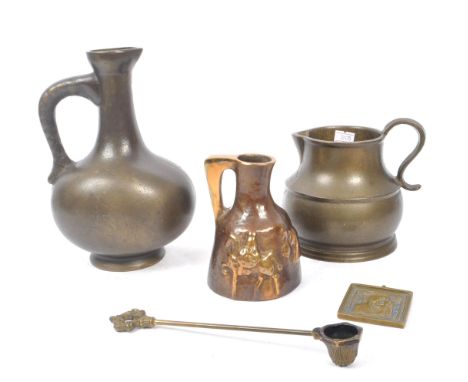 A collection of 20th century bronze and brass pieces. The collection to include a Thelen Creations bronze carafe / jug with r