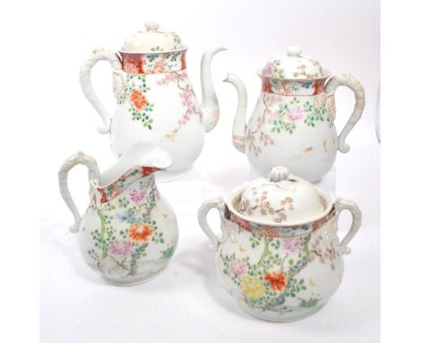 An early 20th century Japanese part tea service. The service consisting of a large and small teapot, alongside a milk jug, an
