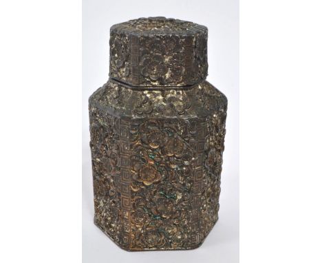 A 19th century Chinese embossed white metal tea caddy. Having a hexagonal form lid with embossed floral body. No makers marks