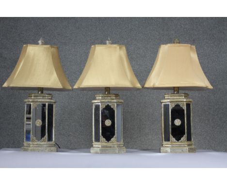 Three Indian style gilded and mirrored panel hexagonal table lamps with gold silk shades. H.71cm 