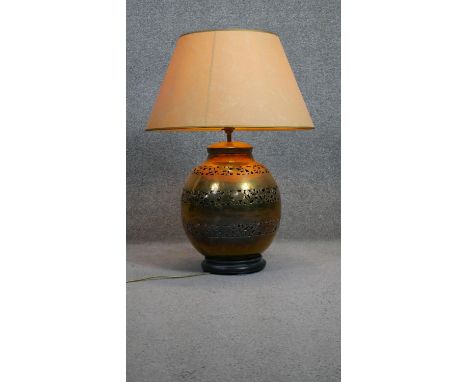 A pierced foliate design brass vase shaped table lamp with shade. H.188 D.30cm 