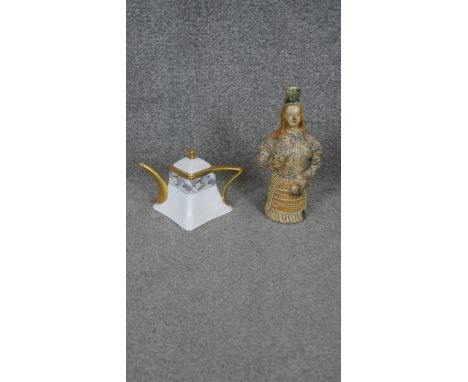 A glazed ceramic bottle in the form of a lady along with a Bavarian hand painted and gilded coffee pot with square design. H.