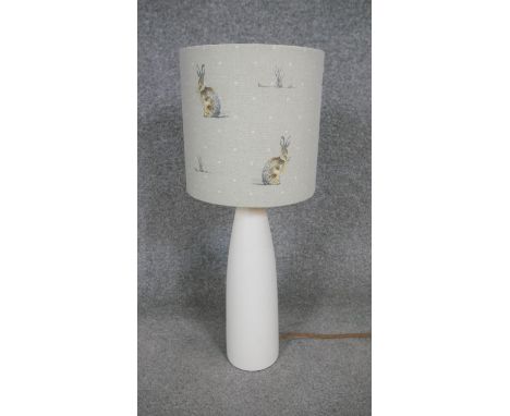 A contemporary cream ceramic table lamp with Hartley Hare fabric lamp shade with brushed gold interior. H.50 x W.22cm 