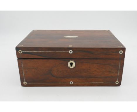 A 19th century rosewood mother of pearl inlaid box of curiosities. Including three geodes, vertebrae, a fossil, carved figure