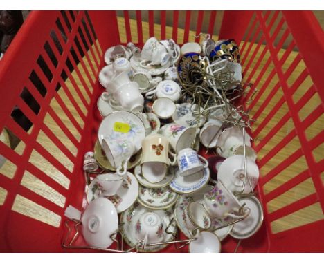 A SMALL TRAY OF MINATURE CUPS AND SAUCERS