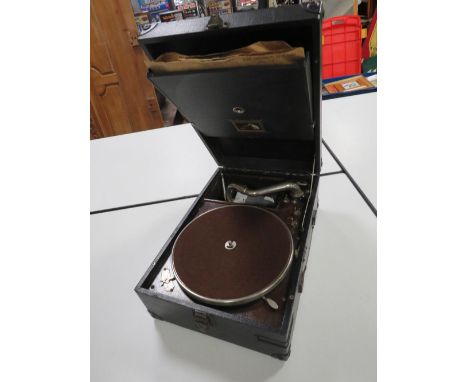 A VINTAGE PORTABLE WIND UP HMV RECORD PLAYER WITH HANDLE AND NEEDLE, IN WORKING ORDER AT THE TIME OF CONSIGNMENT