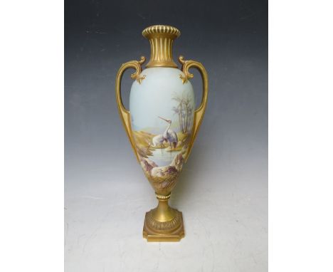 A ROYAL WORCESTER TWIN HANDLED PEDESTAL VASE BY W. POWELL, decorated with storks in a landscape, signed, H 32 cm A/FCondition