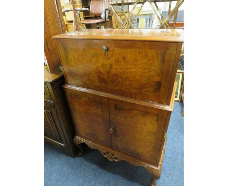 A VINTAGE WALNUT DRINKS CABINET