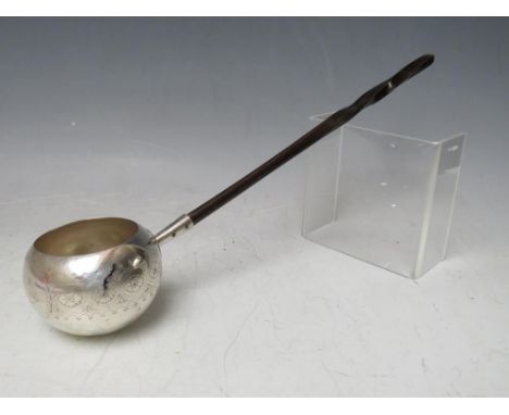 A 19TH CENTURY WHITE METAL TODDY LADLE, with ebonised handle, overall L 36 cm