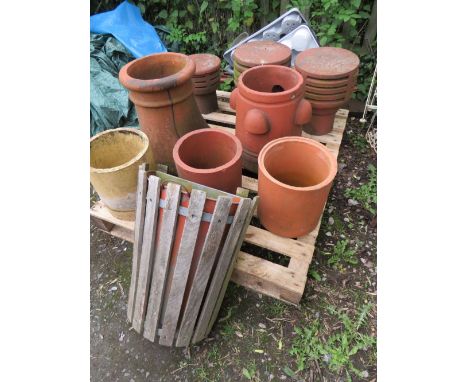A SELECTION OF TERRACOTTA PLANTERS TO INCLUDE CHIMNEY COWLS POTS AND A STRAWBERRY PLANTER PLUS A VINTAGE PARK WALL BIN