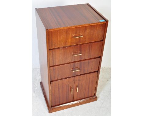 A vintage 20th Century walnut music cabinet. Of square form with opening top to accommodate record player, and two pull down 