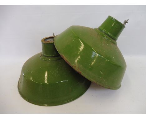 Two green enamel industrial light shades.