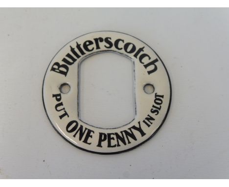 A Butterscotch One Penny enamel slot machine escutcheon, in good condition. 