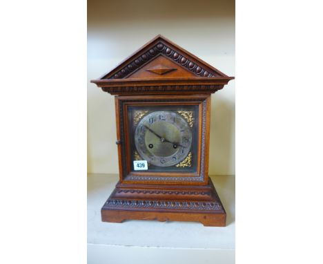 A walnut mantle clock striking on a gong - Height 38cm